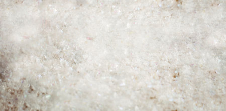 Granular white crystals are filling frame in flat design style, showing translucent off-white tones. Minerals, texture, abstract, minimalist, scientific, natural, materialの写真素材