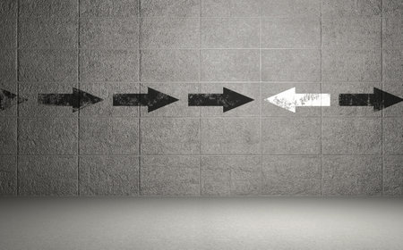 Arrows symbol on checked pattern wallの写真素材