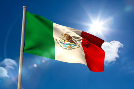 Mexico national flag on blue sky backgroundの写真素材