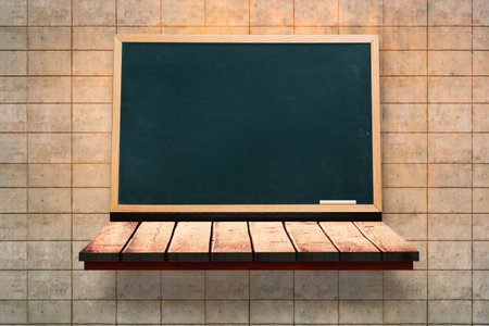 Black board on a wooden shelfの写真素材