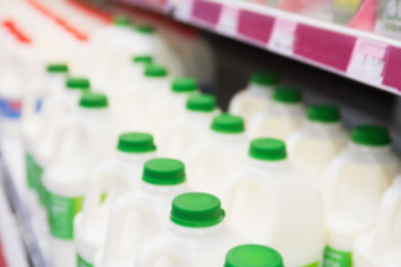 Plastic milk containers for sale in supermarketの写真素材