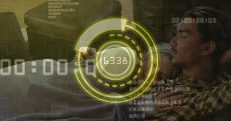 Couple reclining on dark living room sofa viewing data via smartphone with HUD overlay. Relaxation, intimacy, technology, innovation, comfort, connectivity, cozyの写真素材