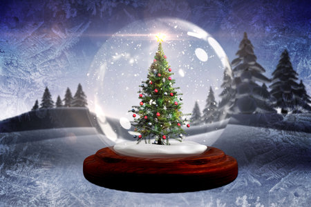 Digitally generated Christmas tree in snow globeの写真素材