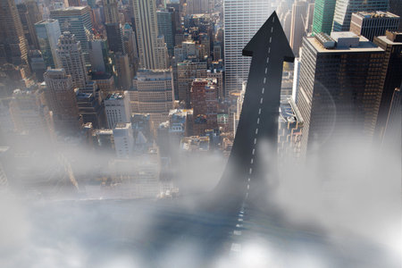 Road turning into an arrow in a cityの写真素材