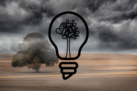 Light bulb graphic on dark landscape