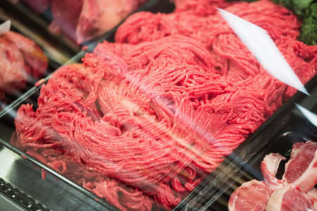 Close-up of meat in containers at supermarketの写真素材