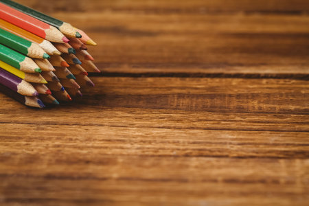 High angle view of color pencils on wooden tableの写真素材