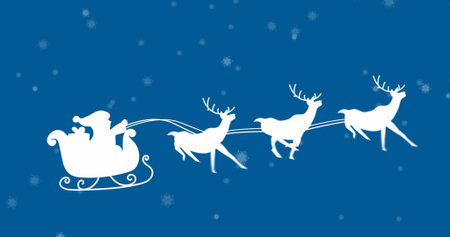 Gliding Santa silhouette delivering gifts against blue snowy sky, with sleigh and three reindeer. Festive, holiday, winter, celebration, seasonal, mythical, traditionの写真素材