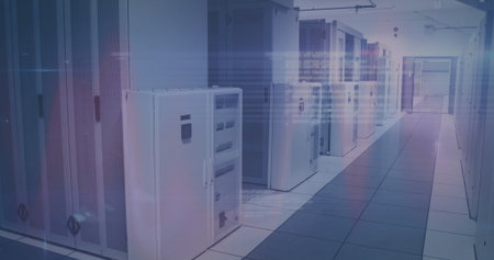 White server cabinets lining data center corridor, with overhead cable trays and raised floor tiles....
