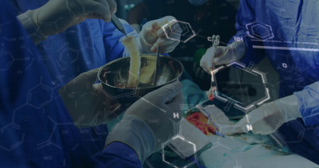 Manipulating tissue graft in bowl using forceps and scalpel in OR with scrubs and chemical overlays. Surgical, research, bioengineering, teamwork, precision, innovation, medicalの写真素材