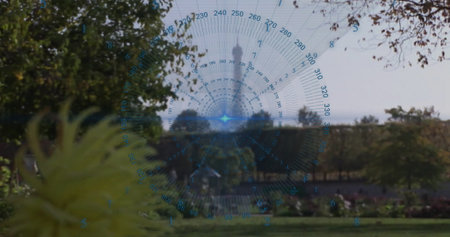 Superimposing digital compass gauge overlay over park lawn, showing yellow flower and green shrubs. Landscape, outdoor, botanical, technology, modern, nature, urbanの写真素材