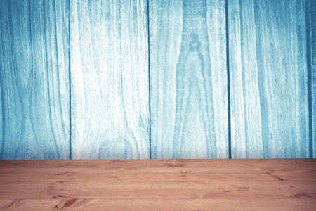 Rustic interior scene is showing wooden table and washed blue plank wall in flat design. Minimalist, natural, textured, heritage, vintage, craftsmanship, cozyの写真素材