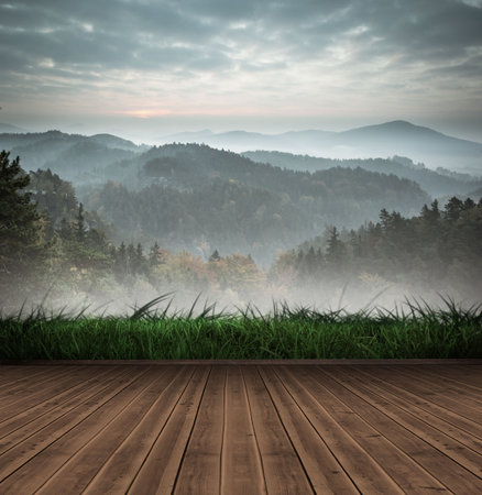 Mountain range beyond wooden floorの写真素材