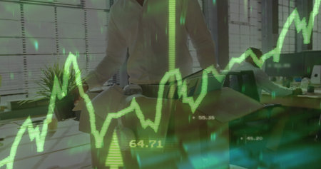 Leaning man in white shirt adjusting architectural model at office, with financial chart overlay....