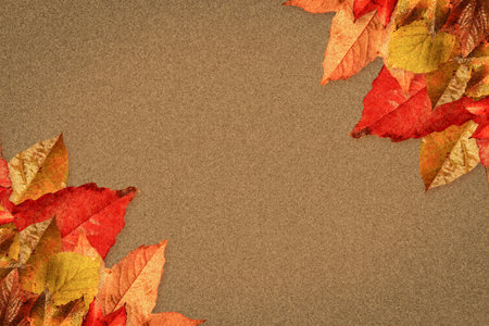 Clusters of autumn leaves are spreading across flat design textured brown paper surface corners....