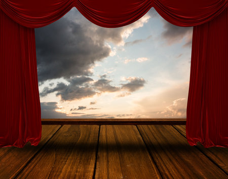 flat design illustration is showing red velvet curtains framing wooden stage floor and cloudy sky. Theatre, stage, scenery, performance, dramatic, ambiance, artisticの写真素材