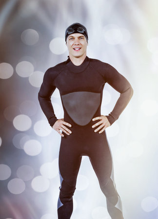 Portrait of smiling swimmer against digitally generated lens flare