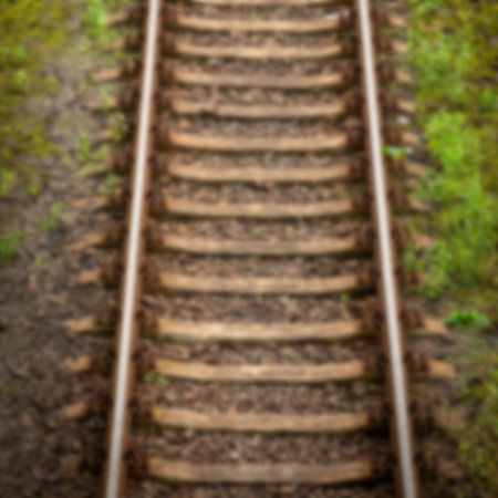 Close up view of railway track amidst of grass