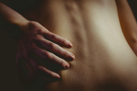 bare torso is showing in low-key 3D render, with hand resting on lower back featuring ring. Minimalist, elegance, portrait, artistic, textured, warm, sophisticatedの写真素材