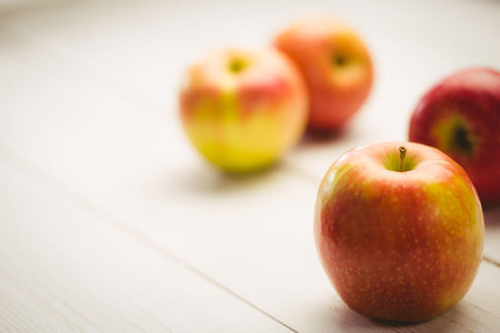 Fresh red apples on wooden tableの写真素材