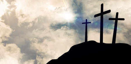 Cross religion symbol shape over sunset skyの写真素材