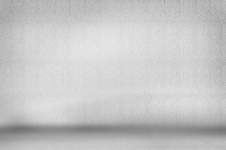 Minimalistic interior is showcasing textured light grey wall meeting smooth grey floor seam. Contemporary, neutral, clean, abstract, modern, versatile, subduedの写真素材