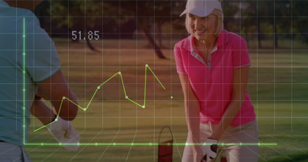 Standing golfers in pink polo and blue polo on fairway holding clubs, grid, graph showing 51.85. Athletic, leisure, outdoor, sport, lifestyle, health, recreationの写真素材