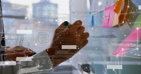 Hand sketching network overlay with marker on glass board in office, colorful sticky notes. Collaboration, brainstorming, innovation, technology, communication, corporate, modernの写真素材