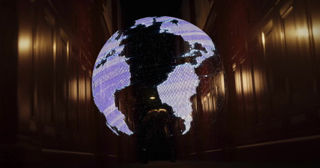 Hanging glowing Earth globe in narrow wood corridor, with crouching figure examining projection. Technology, innovation, exhibit, environment, interior, atmosphere, contemplationの写真素材