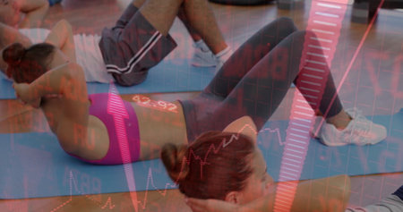 Crunching three exercisers wearing sportswear and shoes on blue mats in studio with red data charts. Fitness, workout, exercise, vitality, athletic, strength, athleticismの写真素材