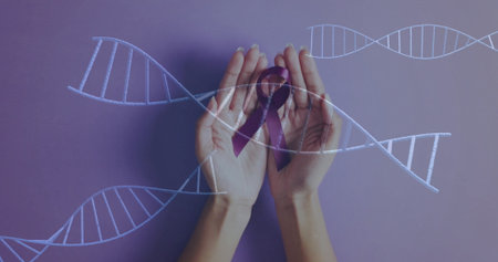 Cradling purple awareness ribbon in adult hands in studio with white DNA double-helix graphics. Support, compassion, healthcare, science, biotechnology, advocacy, medicalの写真素材