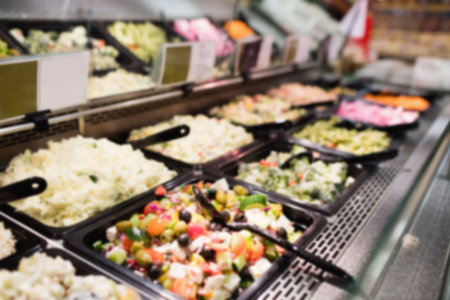 Varieties of salad for sale at supermarketの写真素材