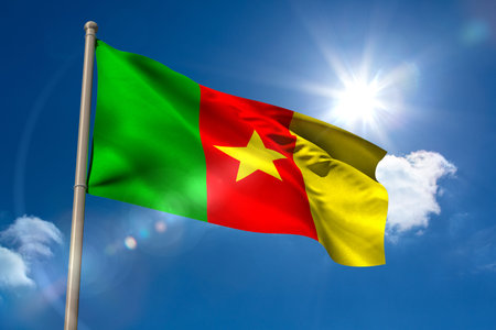Cameroon national flag on blue sky backgroundの写真素材