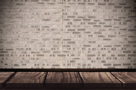 Close-up of gray brick wall against floorboard