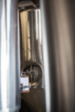 Defocused image of brewery equipment at factory