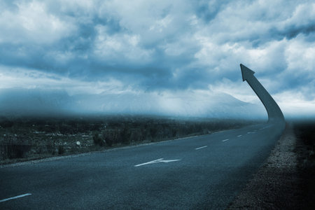 3D render road arrow sculpture is curving upward into stormy sky with misty mountains. Landscape,...