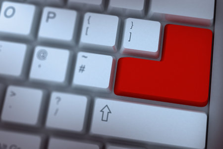 Digitally generated Red enter key on keyboardの写真素材