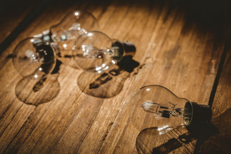 Light bulbs on table on wooden tableの写真素材