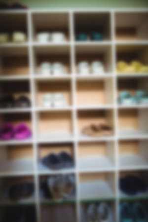 Blurry view of footwear being kept in rackの写真素材