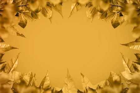 Golden leaf border frame is forming flat design with warm gradient background, copy space....