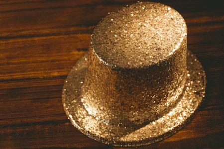 High angle view of copper color hat on wooden table