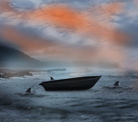 Sail boat being circled by sharks at nightの写真素材