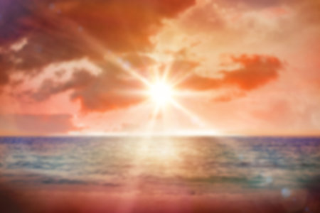 Beach against cloudy sky during sunset