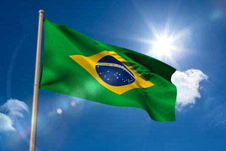 Brazil national flag on blue sky backgroundの写真素材