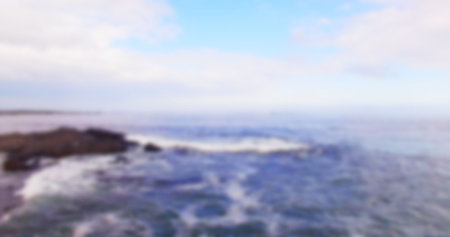 Defocused image of sea against skyの写真素材