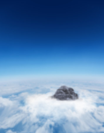 Aerial view of mountain with cloudscape against clear blue sky