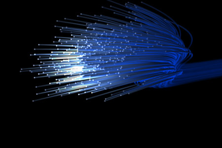 Graphic image of illuminated fiber optics against black backgroundの写真素材