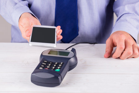 Man using smartphone to express payの写真素材