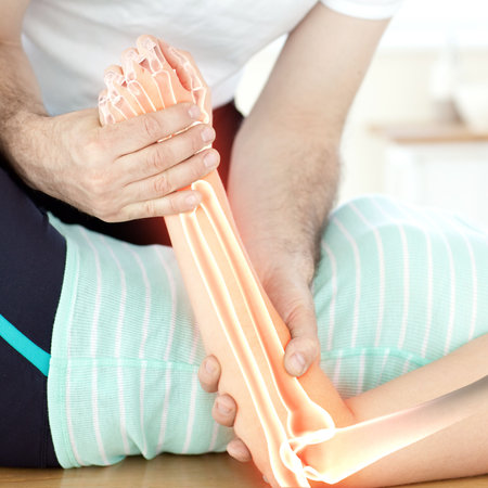 Highlighted bones of injured woman having hand massage
