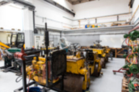 Defocused image of machinery parked at factory